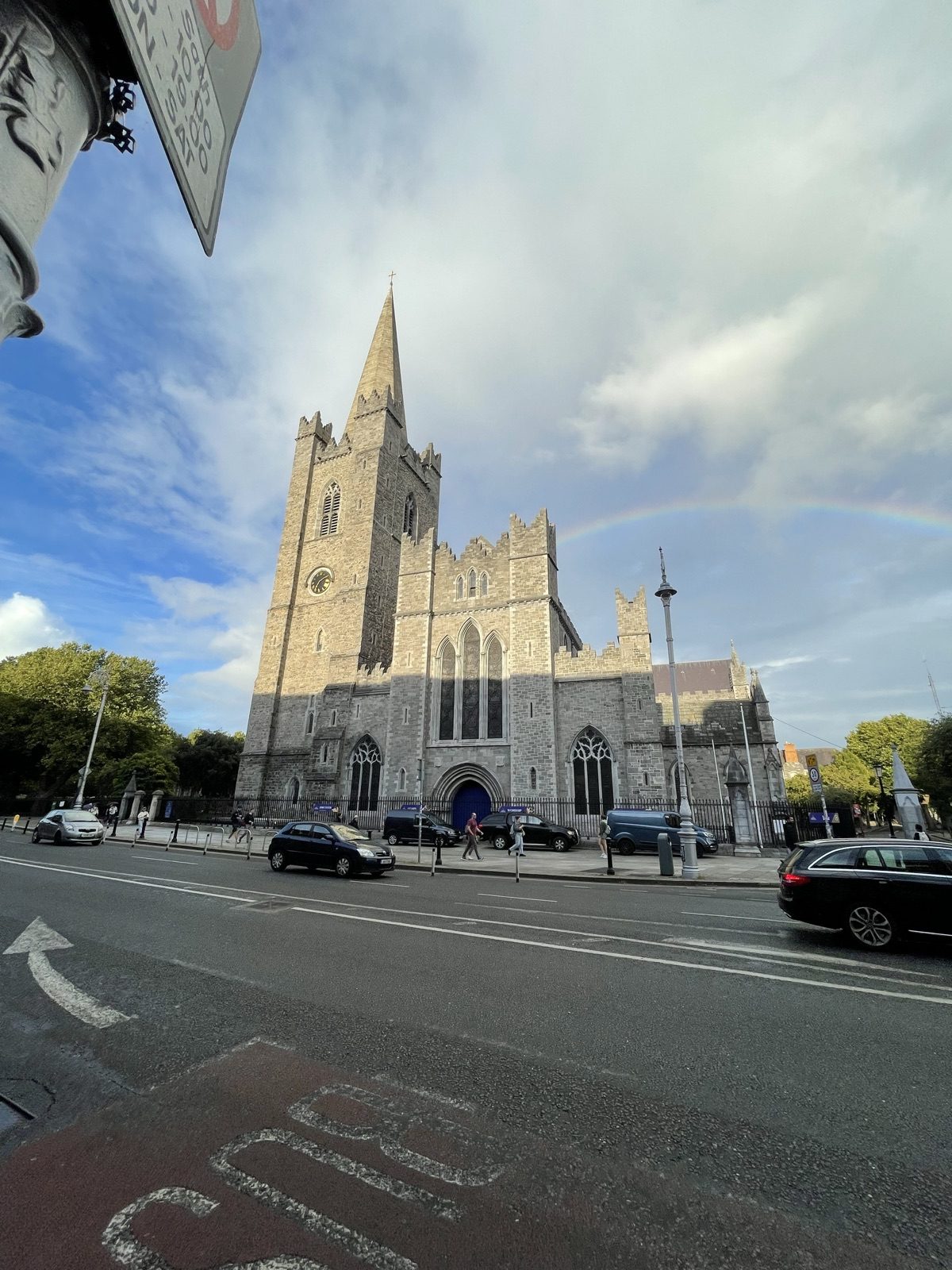 Rainbow ending on a cathedral roof